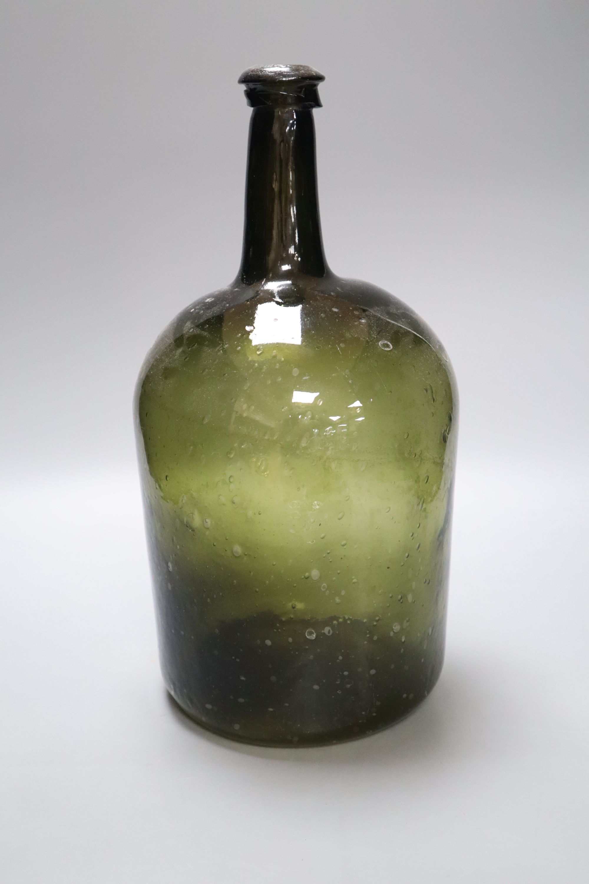 A 19th century green glass demijohn bottle, 34cm